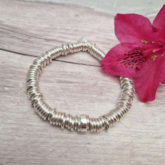 Silver stacked hoops stretch bracelet.