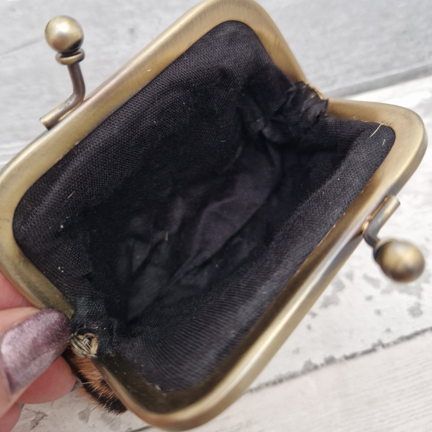 Plain black interior of a coin purse