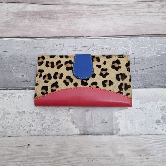 Pink Leather purse with textured leopard print covering.