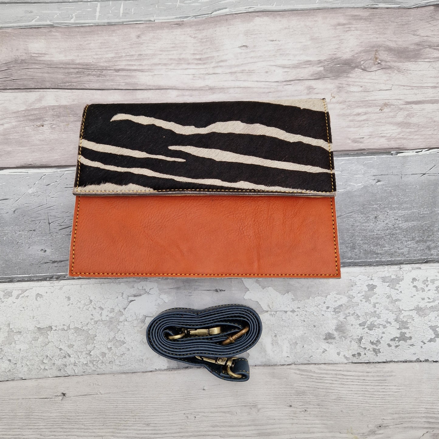 Orange Leather Handbag with a Zebra Print Panel.