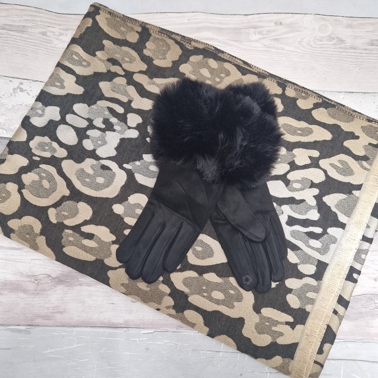 Shimmering Black and Gold Leopard print scarf with a pair of black gloves with a faux fur cuff.