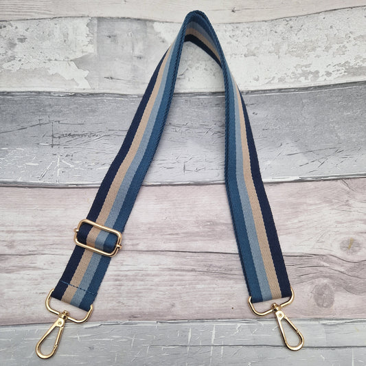 Multi-coloured striped bag strap in shades of blue and taupe.