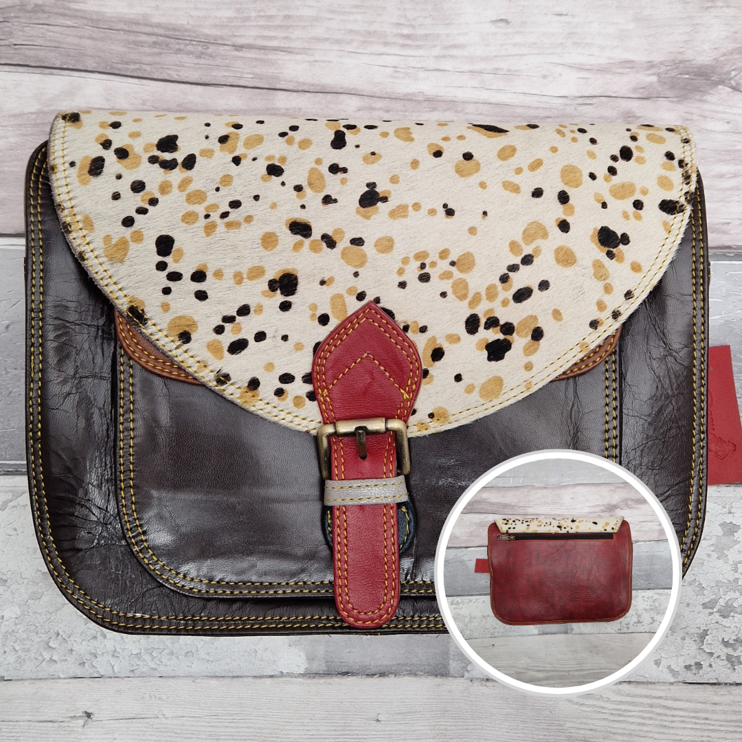 Large Saddlebag style leather crossbody bag. Multicoloured panels of brown shades finished with a spot print textured flap.