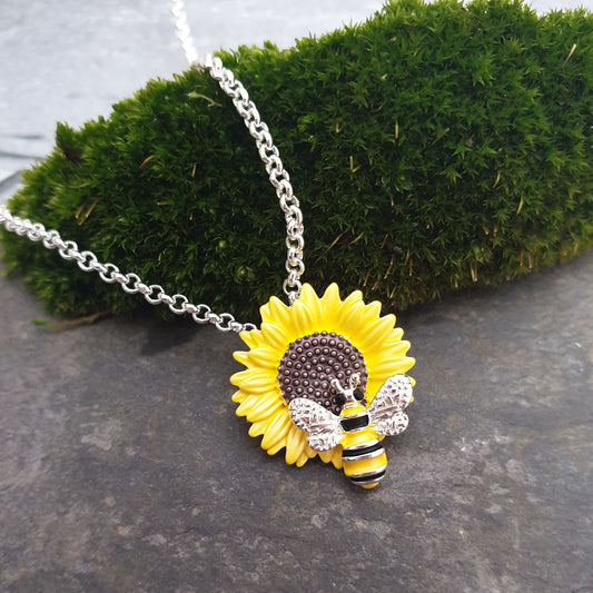 Photo of a Yellow Sunflower Pendant with a Bumble Bee sitting on top.