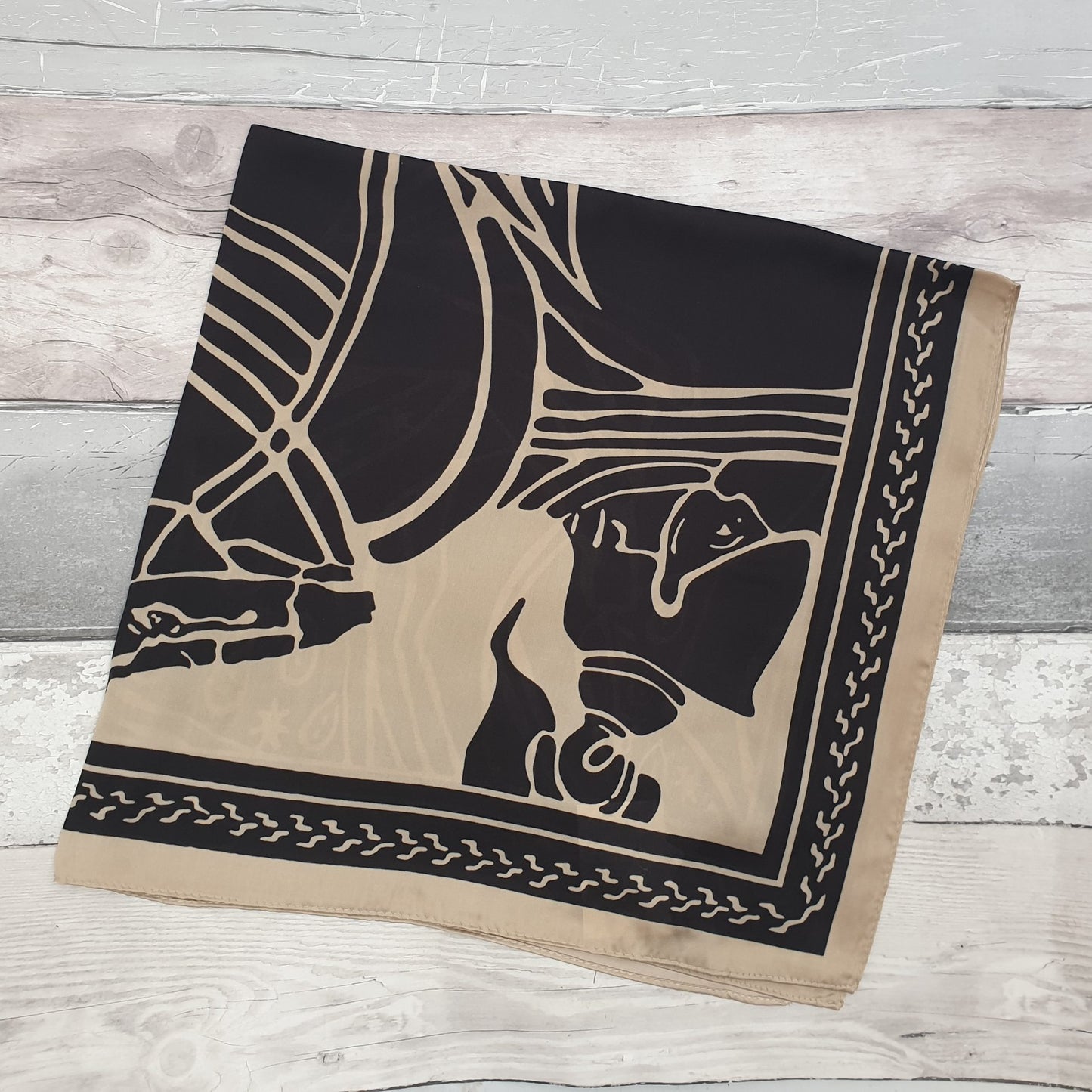 Coffee and black coloured scarf with a ancient horsemen print