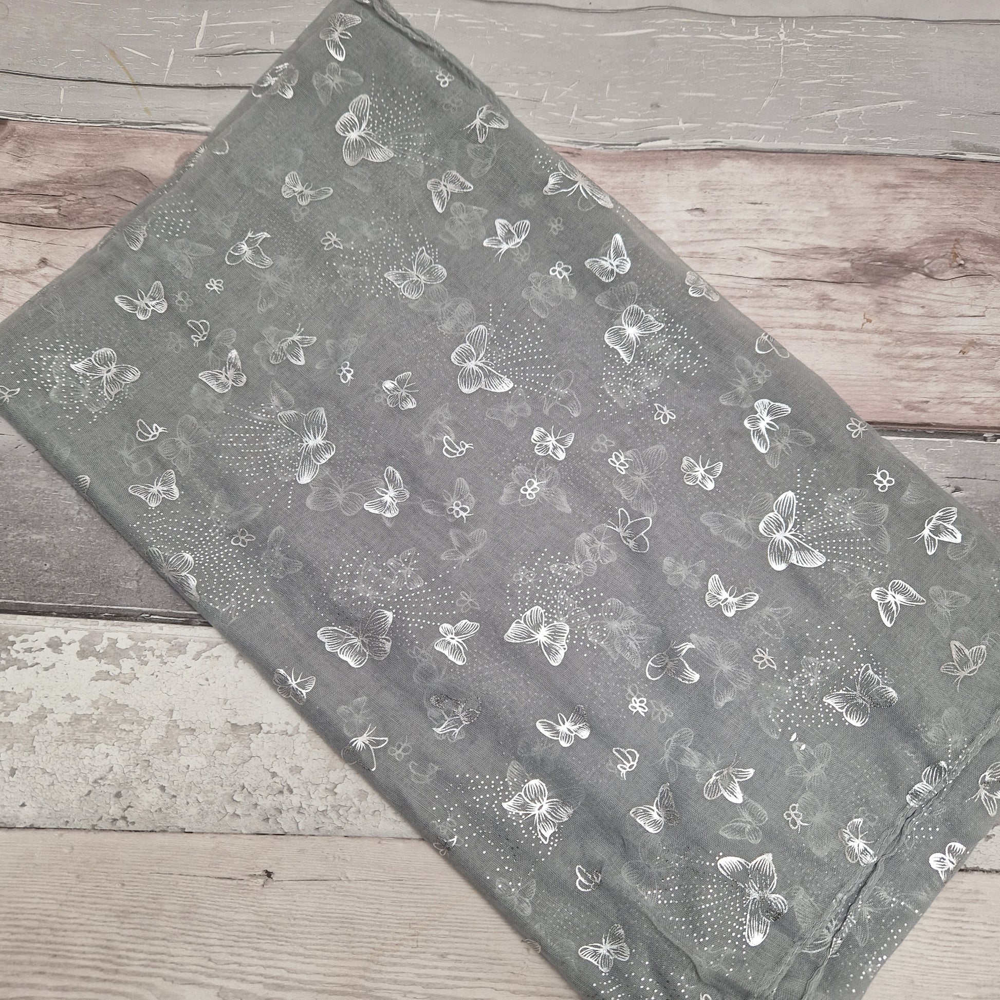 Dove Grey Scarf covered in metallic silver grey butterflies.