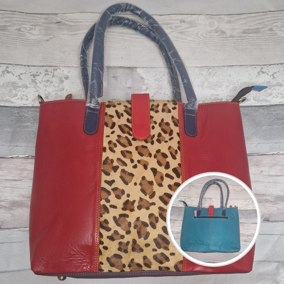 All leather tote bag in bright red with a textured panel down the centre in a leopard print.