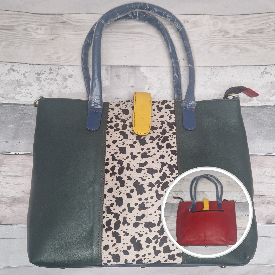 All leather tote bag in dark green with a textured panel down the centre in a black and white cow print.
