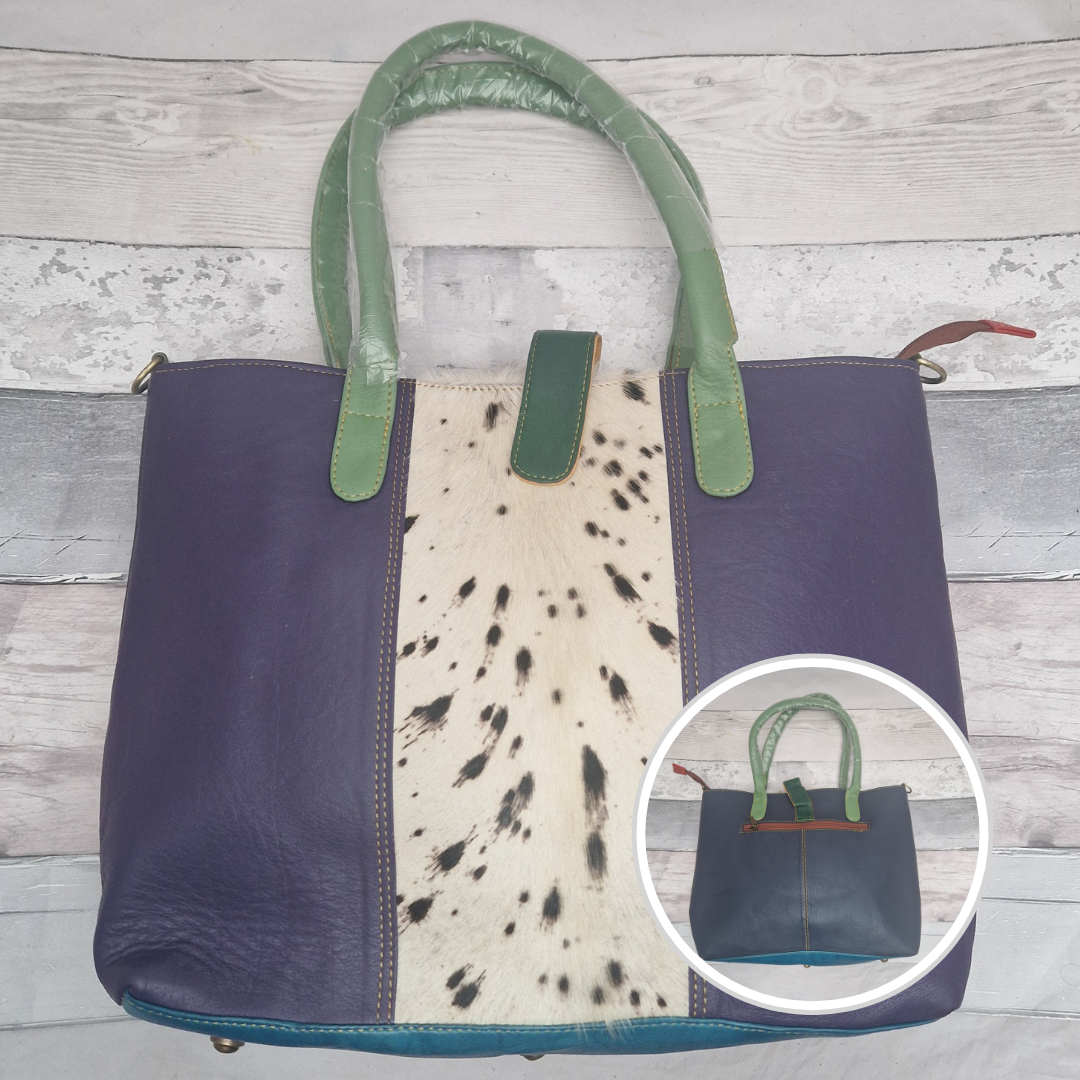 All leather tote bag in purple with a textured panel down the centre in a black and white pony print.