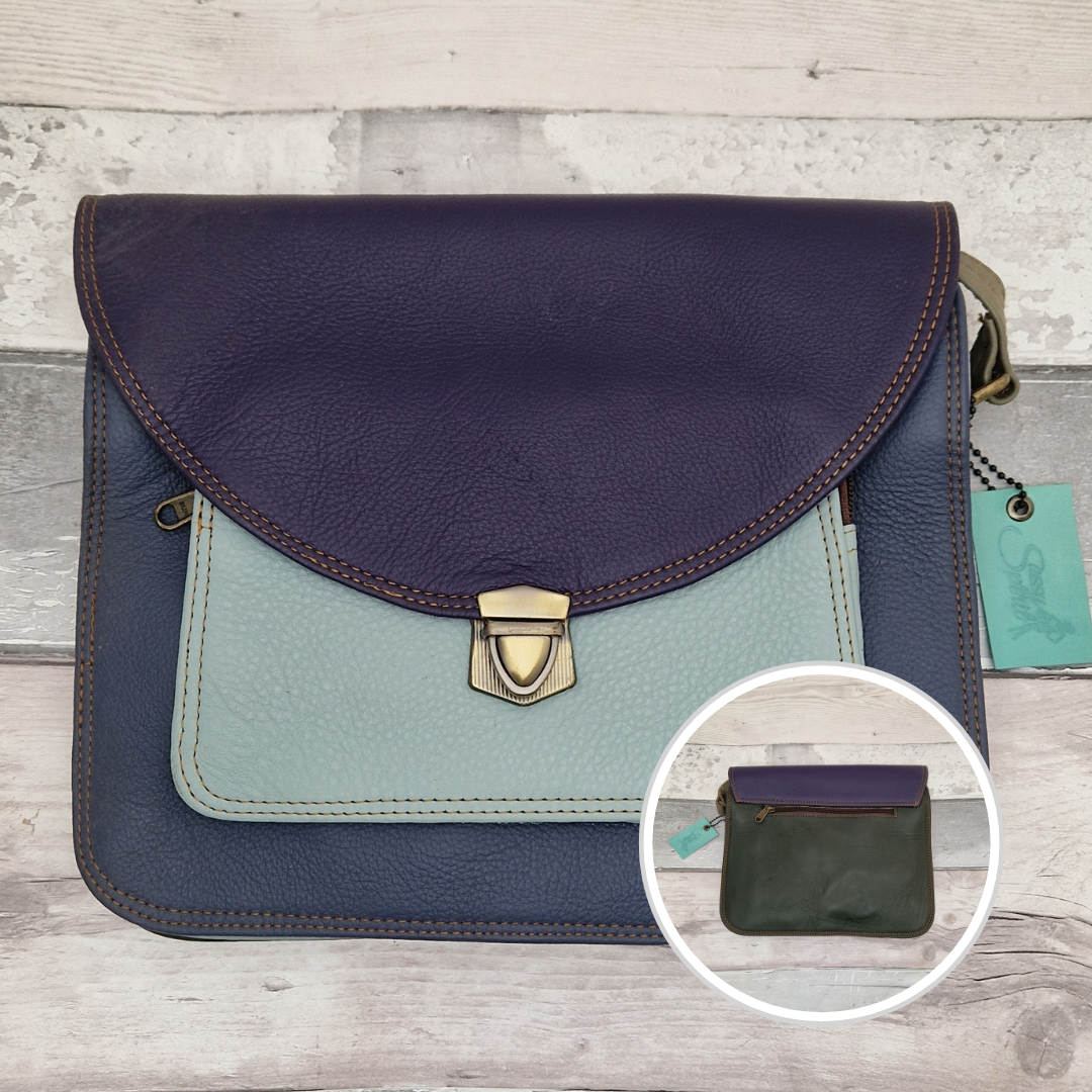 Two-tone handbag with a close-up inset on a wooden surface