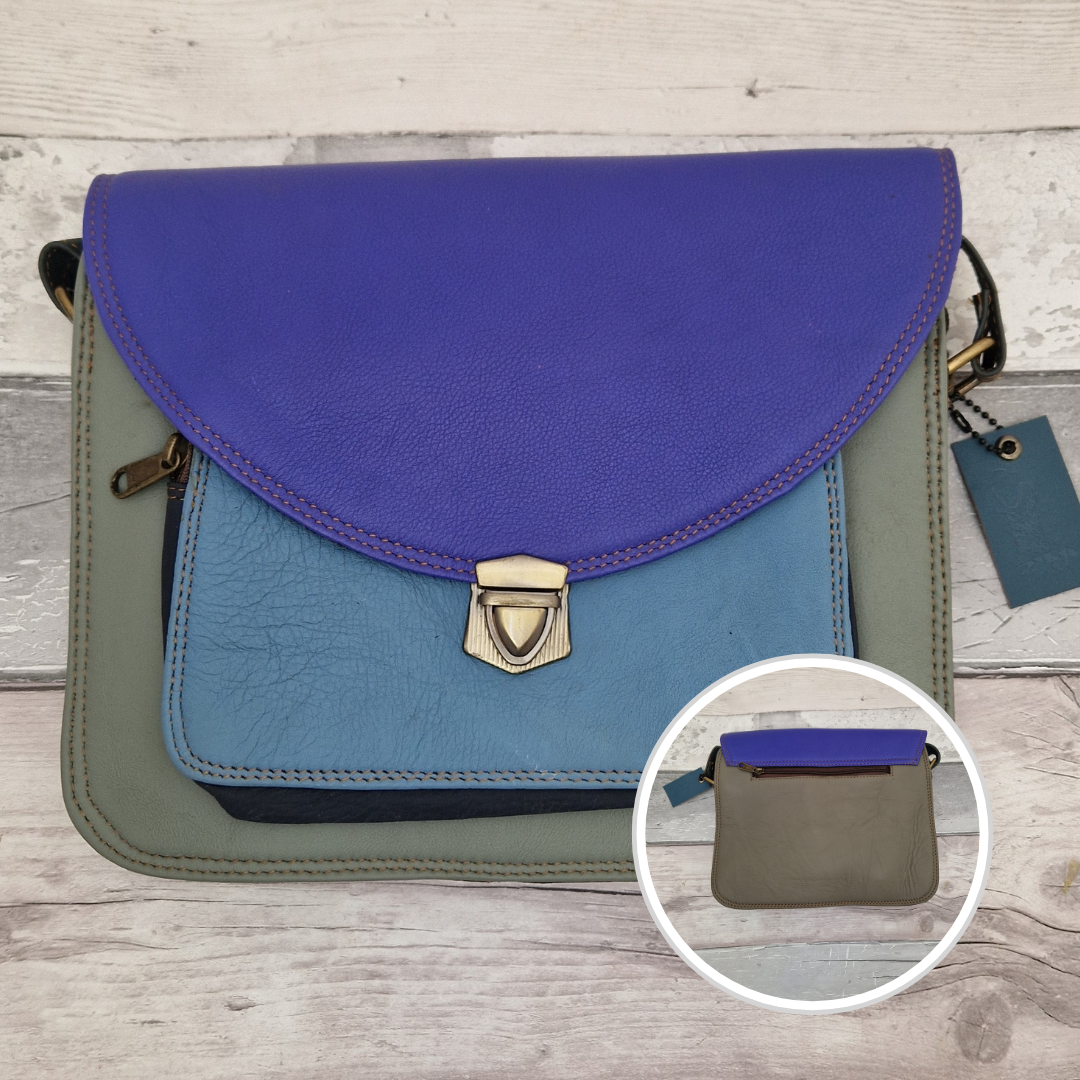 Multicolored handbag with a close-up inset on a wooden surface