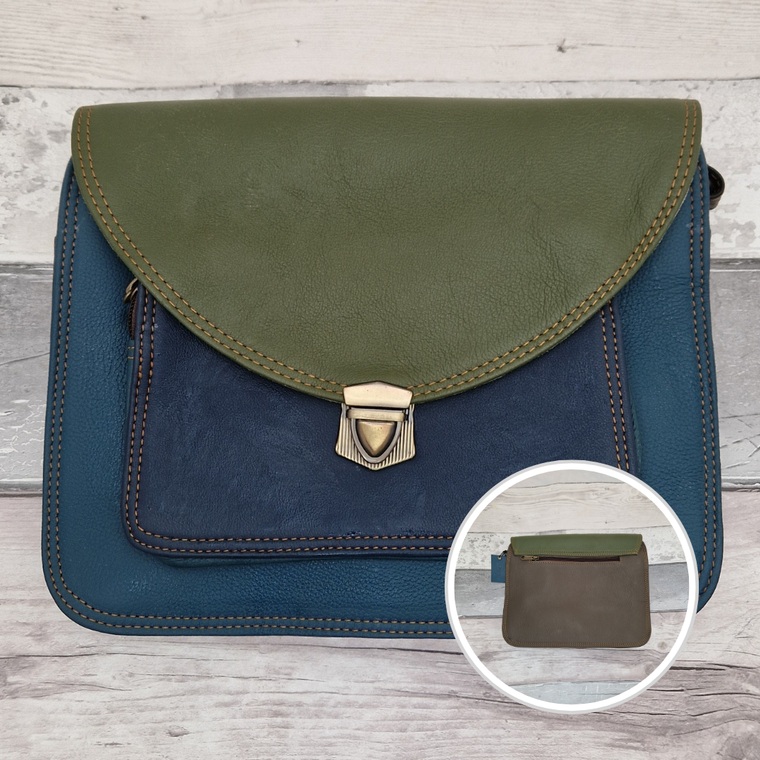 Green and blue leather bag with a smaller inset showing a zipper pocket on a wooden surface.