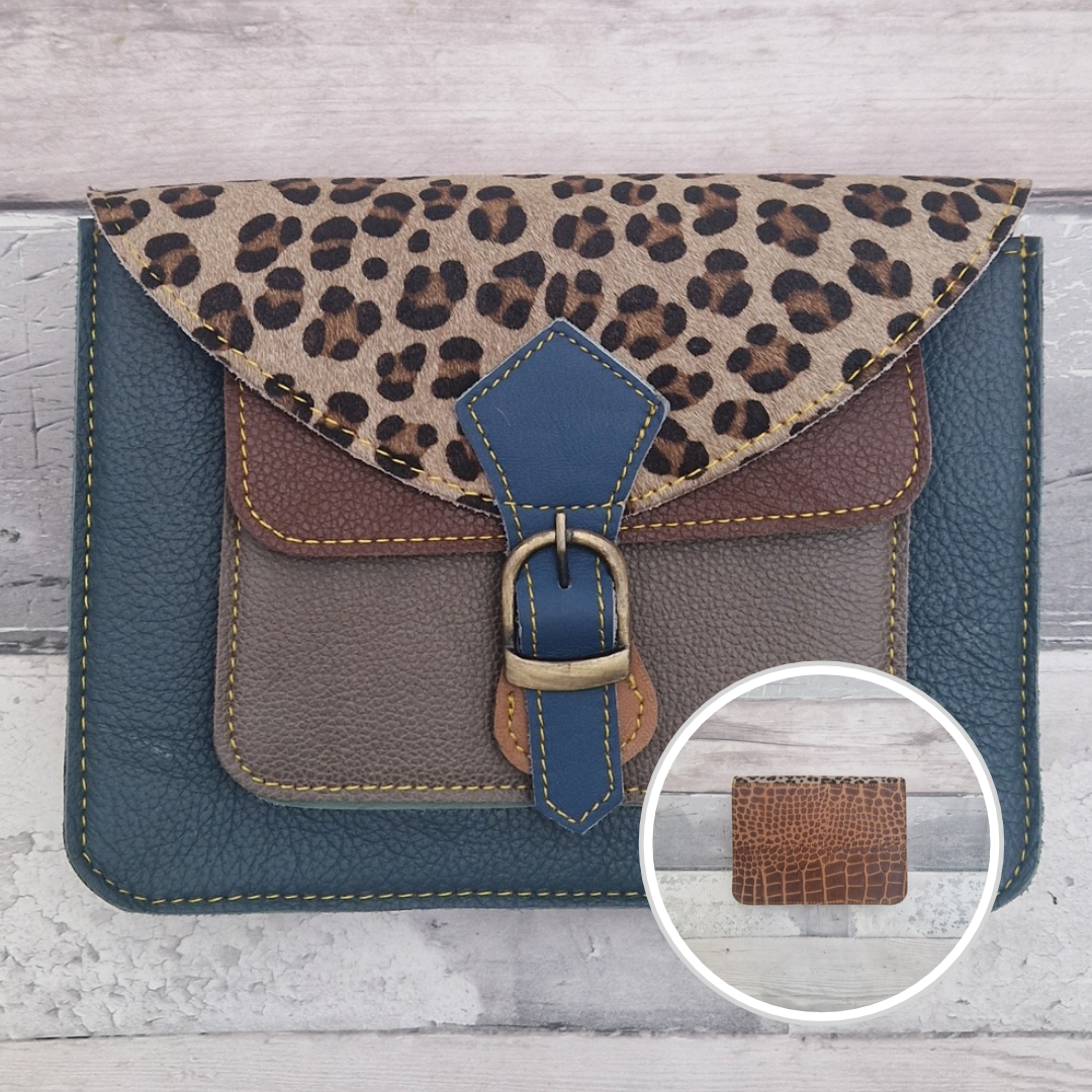 Mini satchel style crossbody bag made with in turquoise with contrasting coloured panels, a buckle closing tab and a textured panel of leopard print.