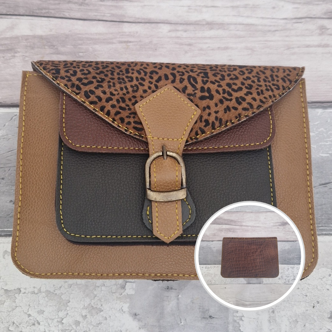 Mini satchel style crossbody bag made in light tan with contrasting coloured panels, a buckle closing tab and a textured panel of cheetah print.