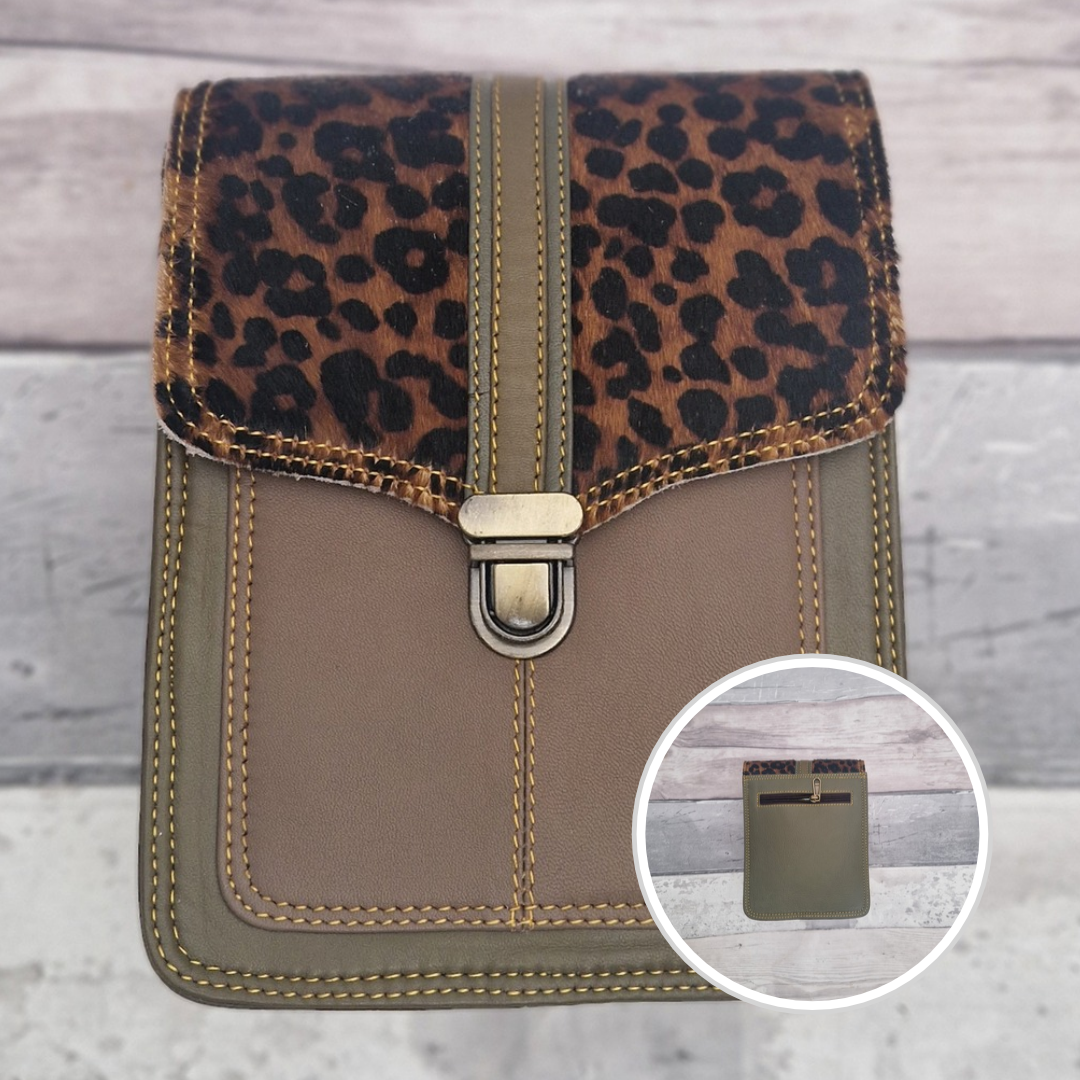 Green leather crossbody bag with a textured panel of cheetah print. Accessed via a push clasp.