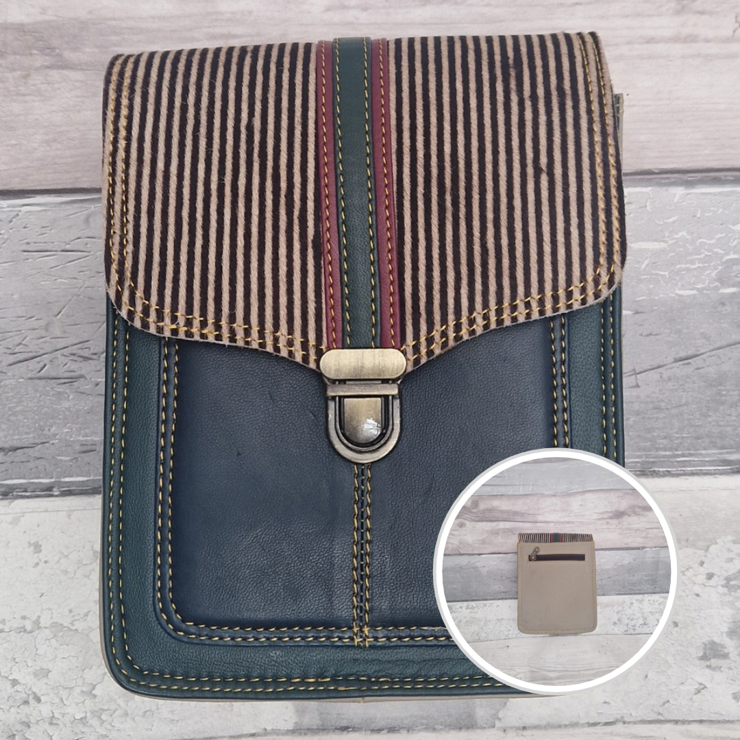 Turquoise leather crossbody bag with a textured panel of striped print. Accessed via a push clasp.