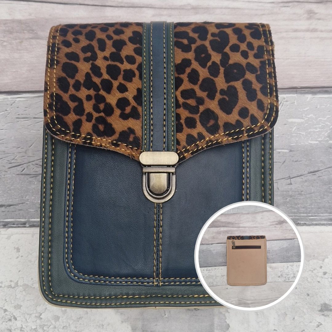 Turquoise leather crossbody bag with a textured panel of cheetah print. Accessed via a push clasp.