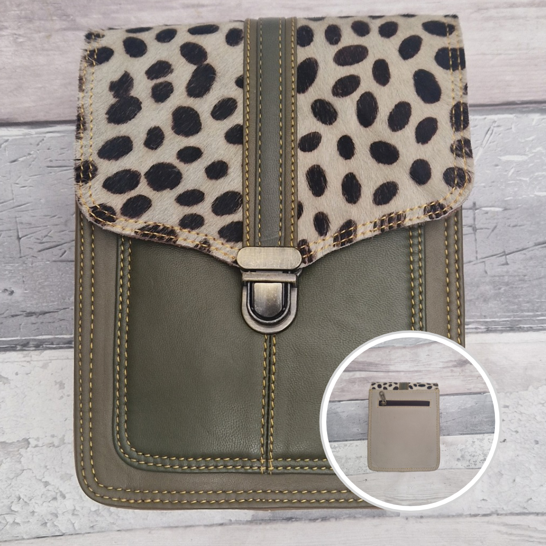 Green leather crossbody bag with a textured panel of spot print. Accessed via a push clasp.