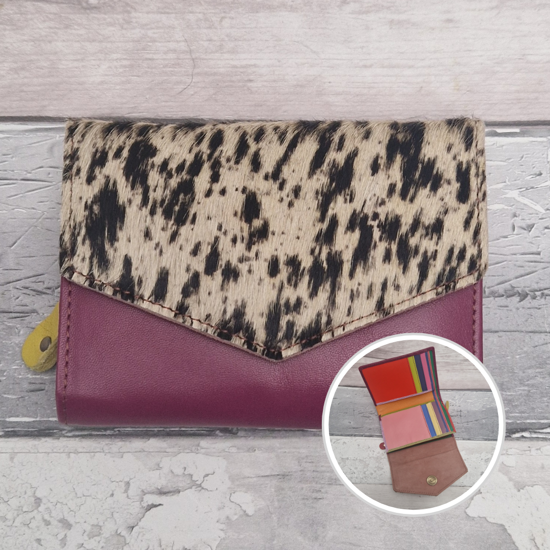 Burgundy leather purse with a textured panel of pony print.