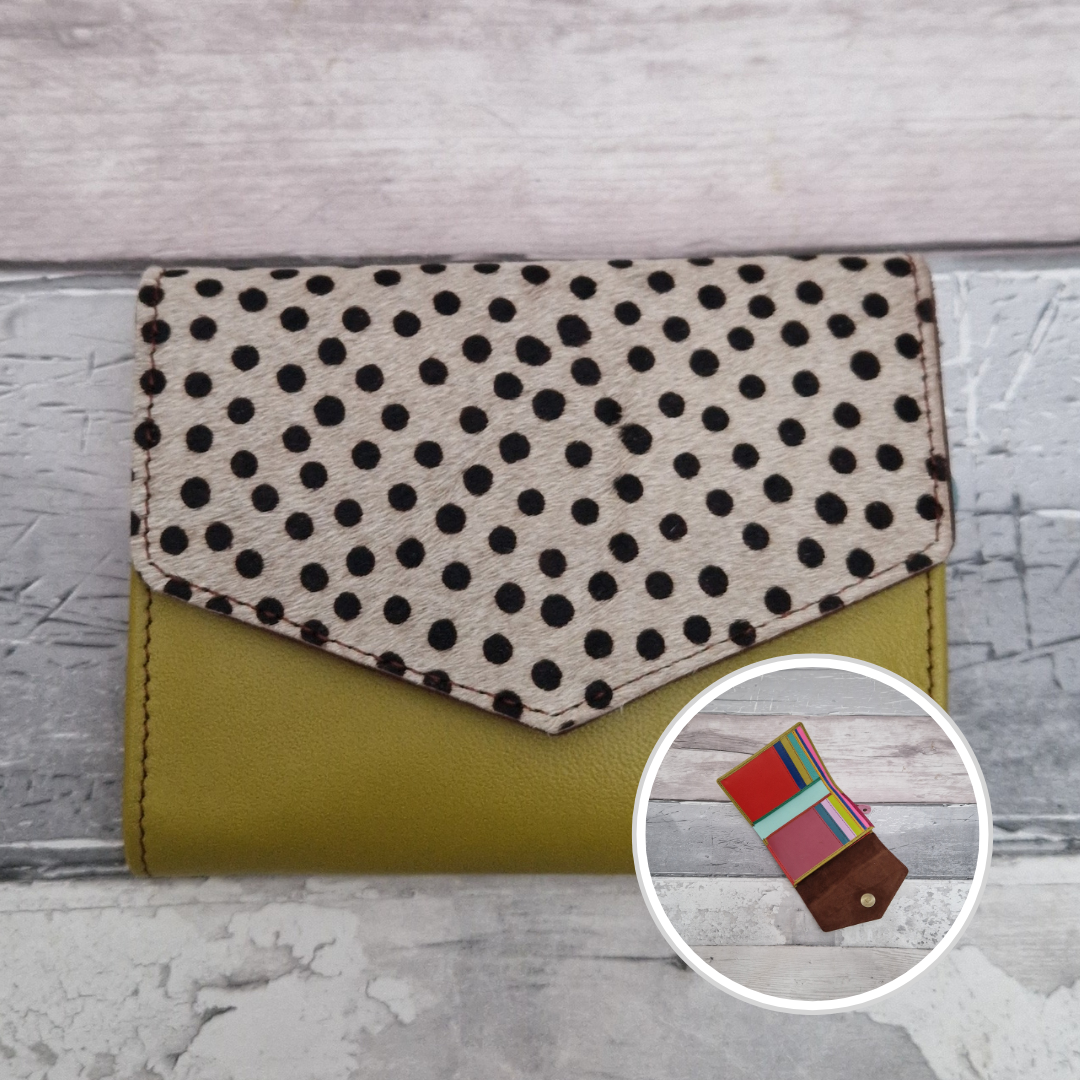 Mustard leather fold out purse with a textured spotty front panel and multi-coloured interior.