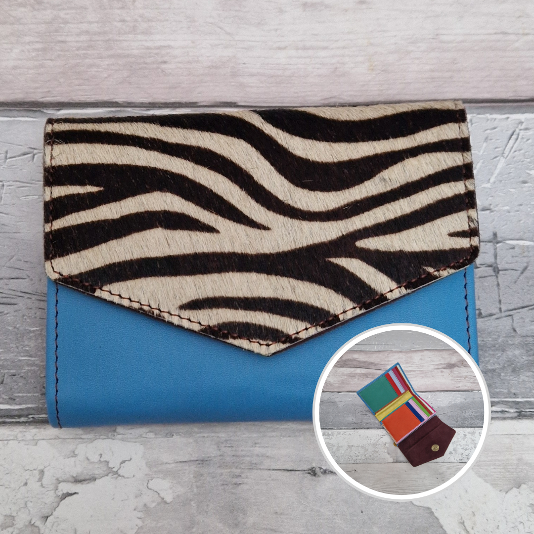 Blue leather fold out purse with a textured zebra front panel and multi-coloured interior.