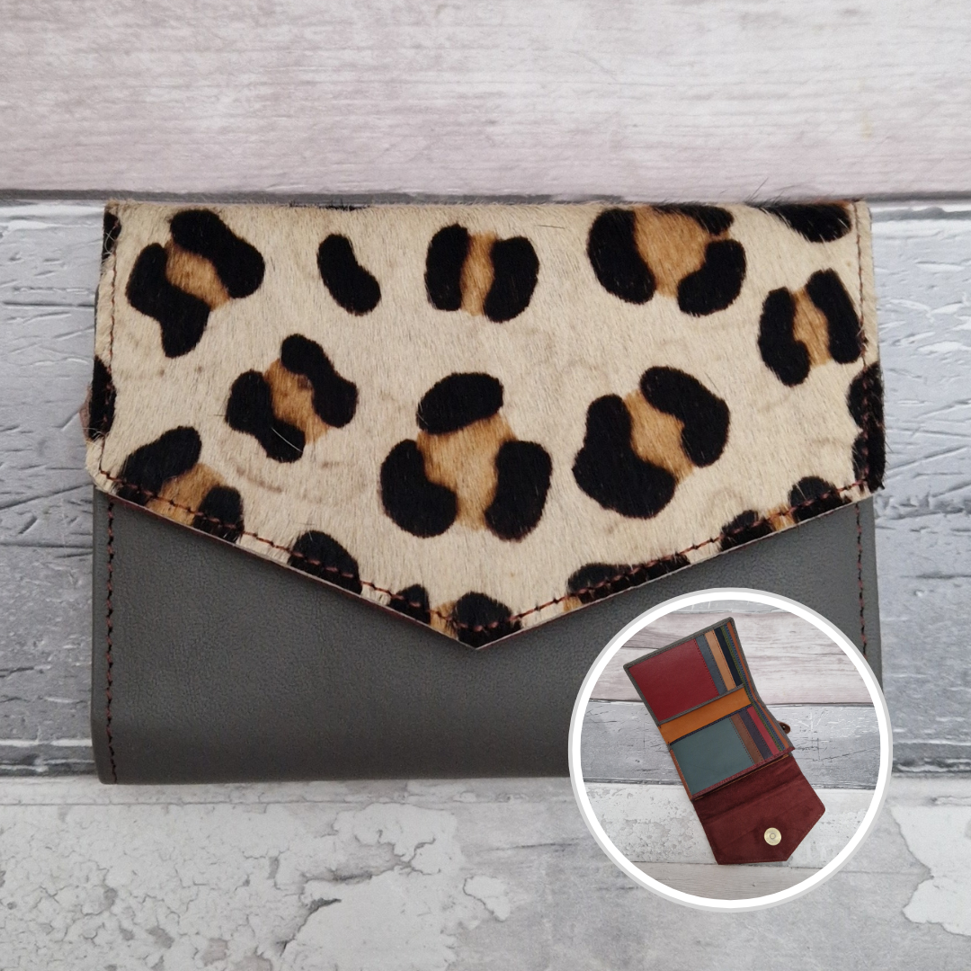 Grey leather fold out purse with a textured leopard print front panel and multi-coloured interior.