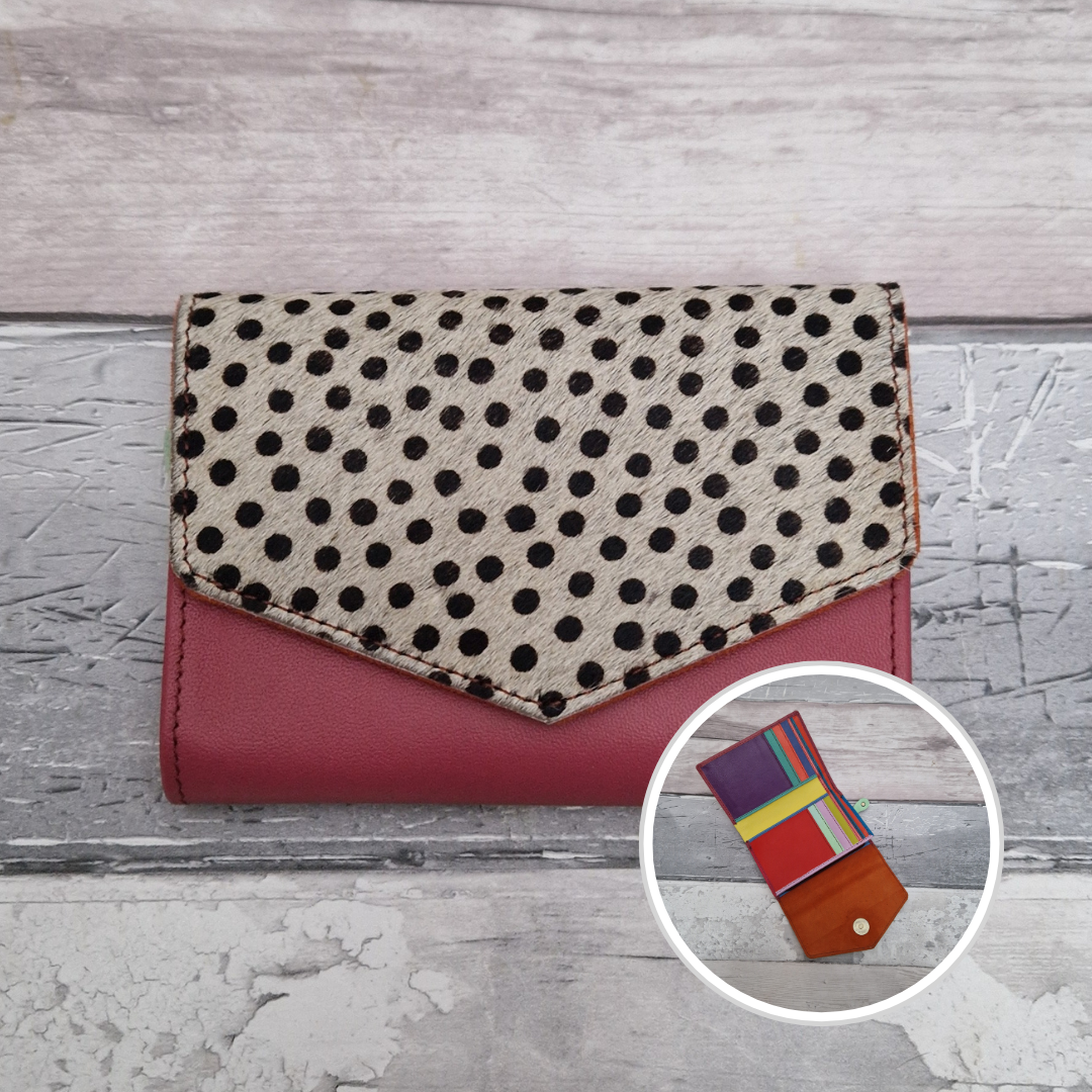 Pink leather fold out purse with a textured spotty front panel and multi-coloured interior.