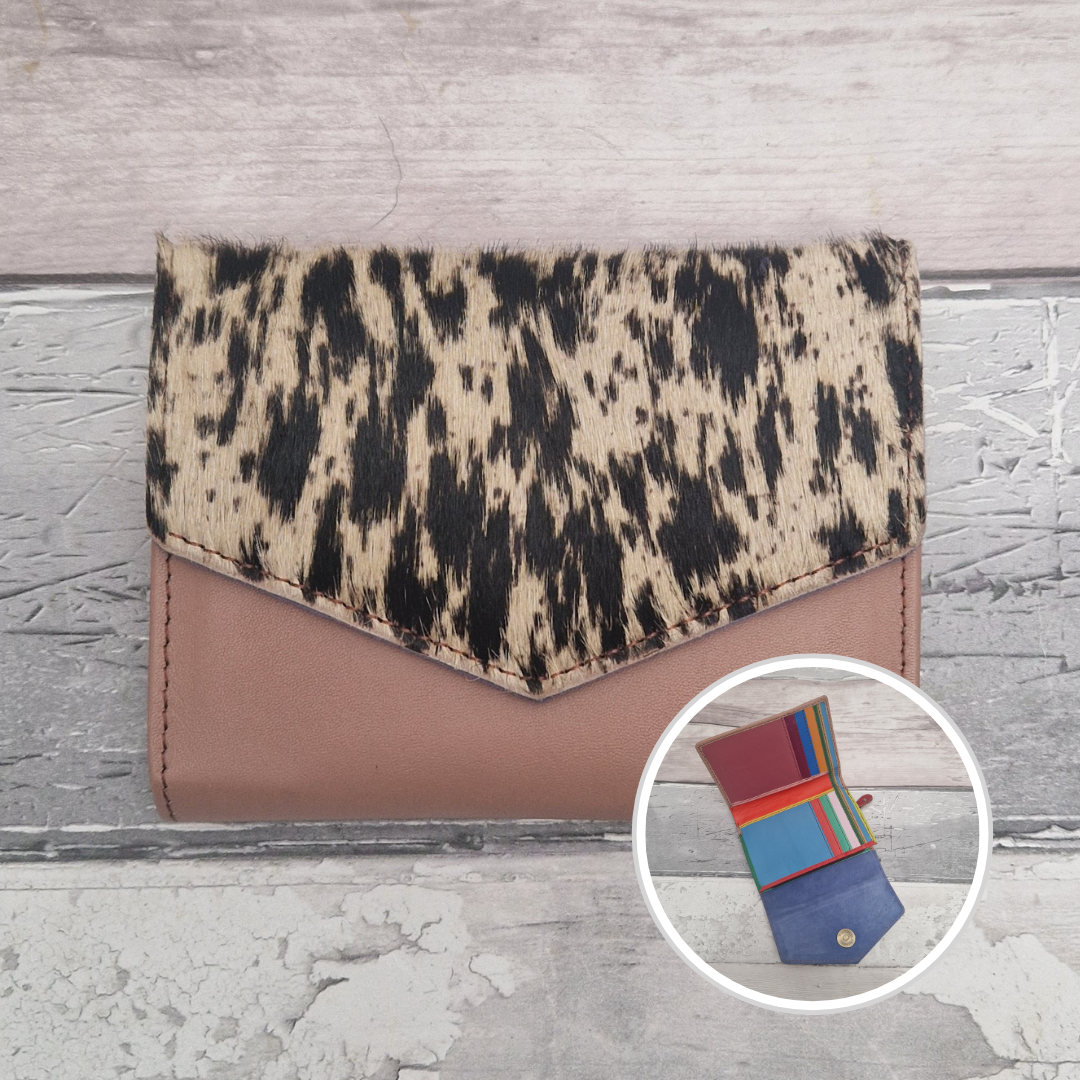 Pink leather fold out purse with a textured pony print front panel and multi-coloured interior.