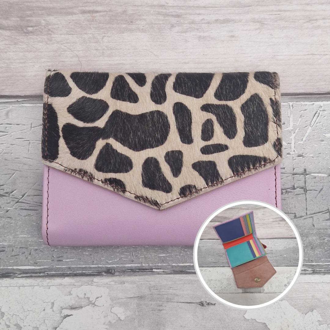 Lilac leather purse with a textured panel of giraffe print.