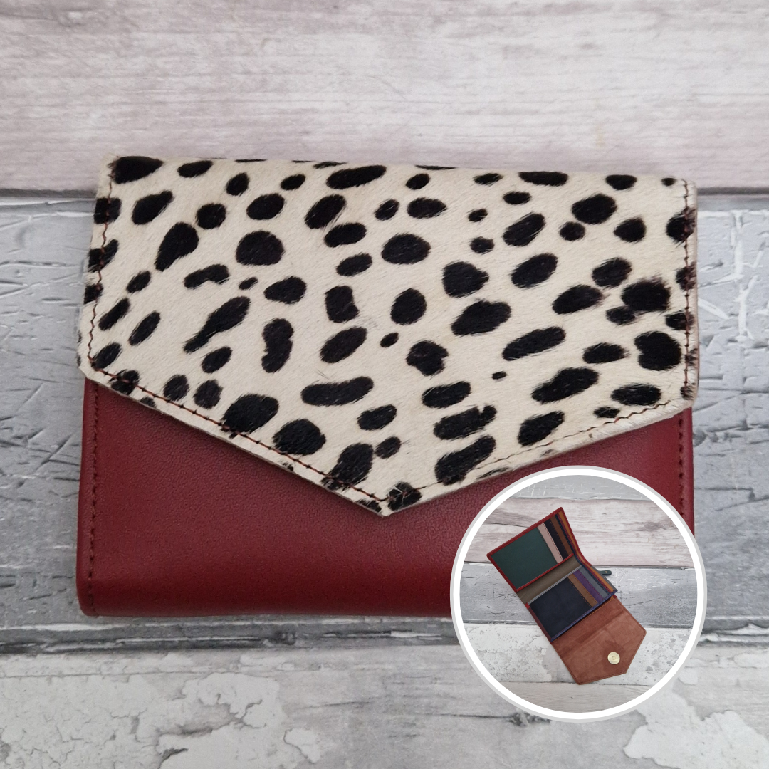 Dark Red leather fold out purse with a textured spotty front panel and multi-coloured interior.