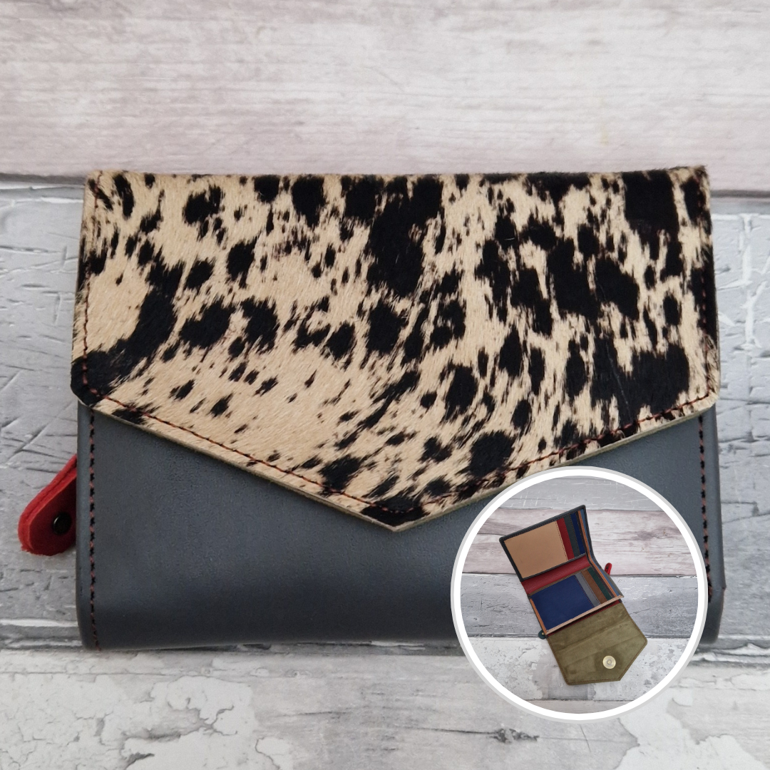 Stone blue leather fold out purse with a textured pony front panel and multi-coloured interior.