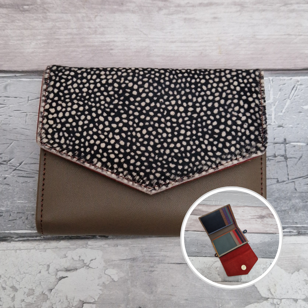 Brown leather fold out purse with a textured spotty front panel and multi-coloured interior.