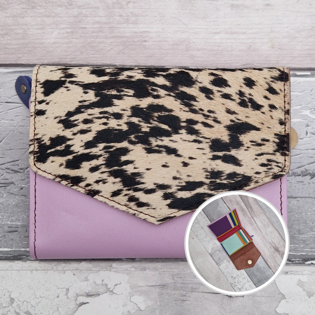 Lilac leather fold out purse with a textured pony print front panel and multi-coloured interior.