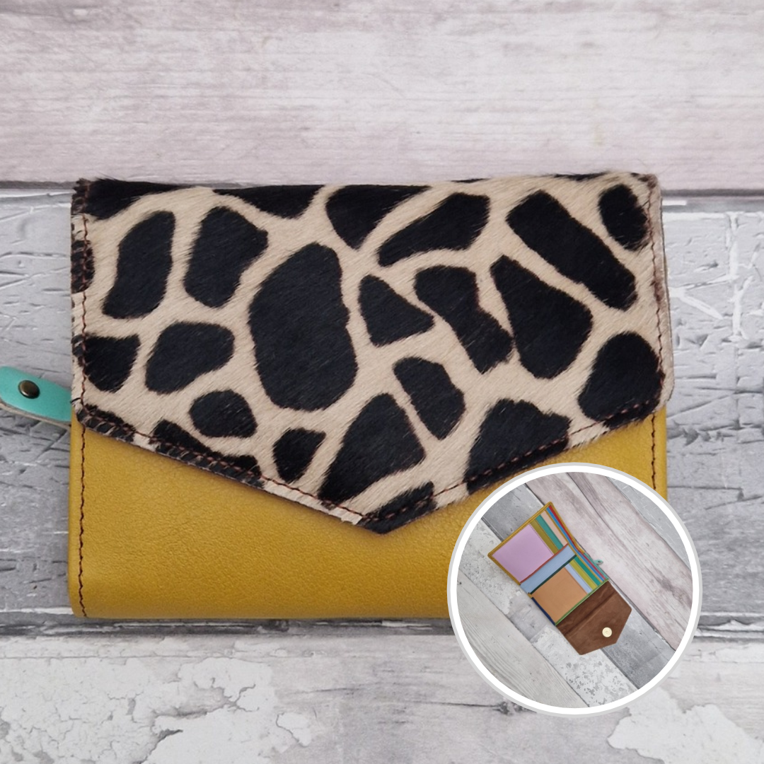 Mustard leather fold out purse with a textured giraffe front panel and multi-coloured interior.