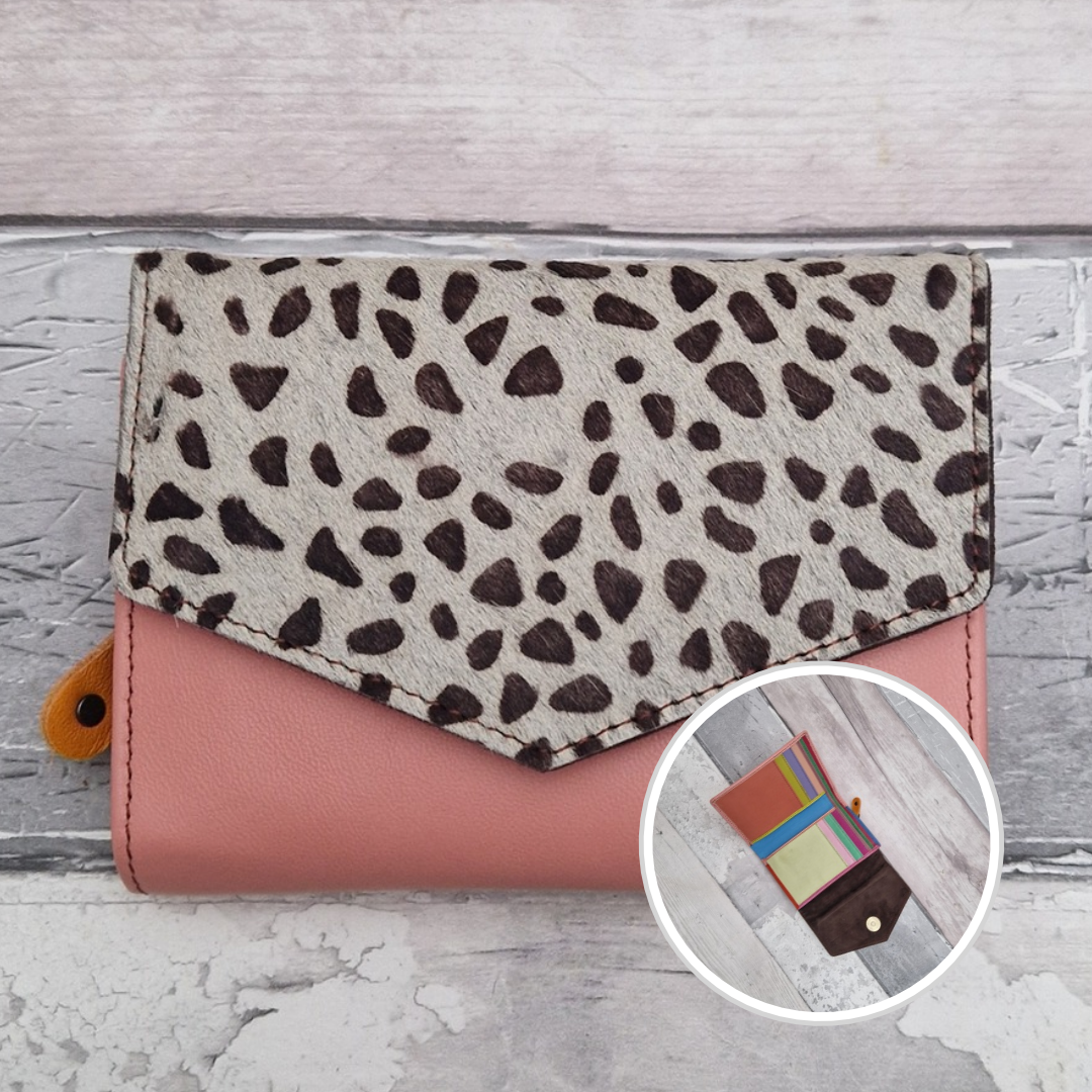 Pink leather fold out purse with a textured lynx front panel and multi-coloured interior.