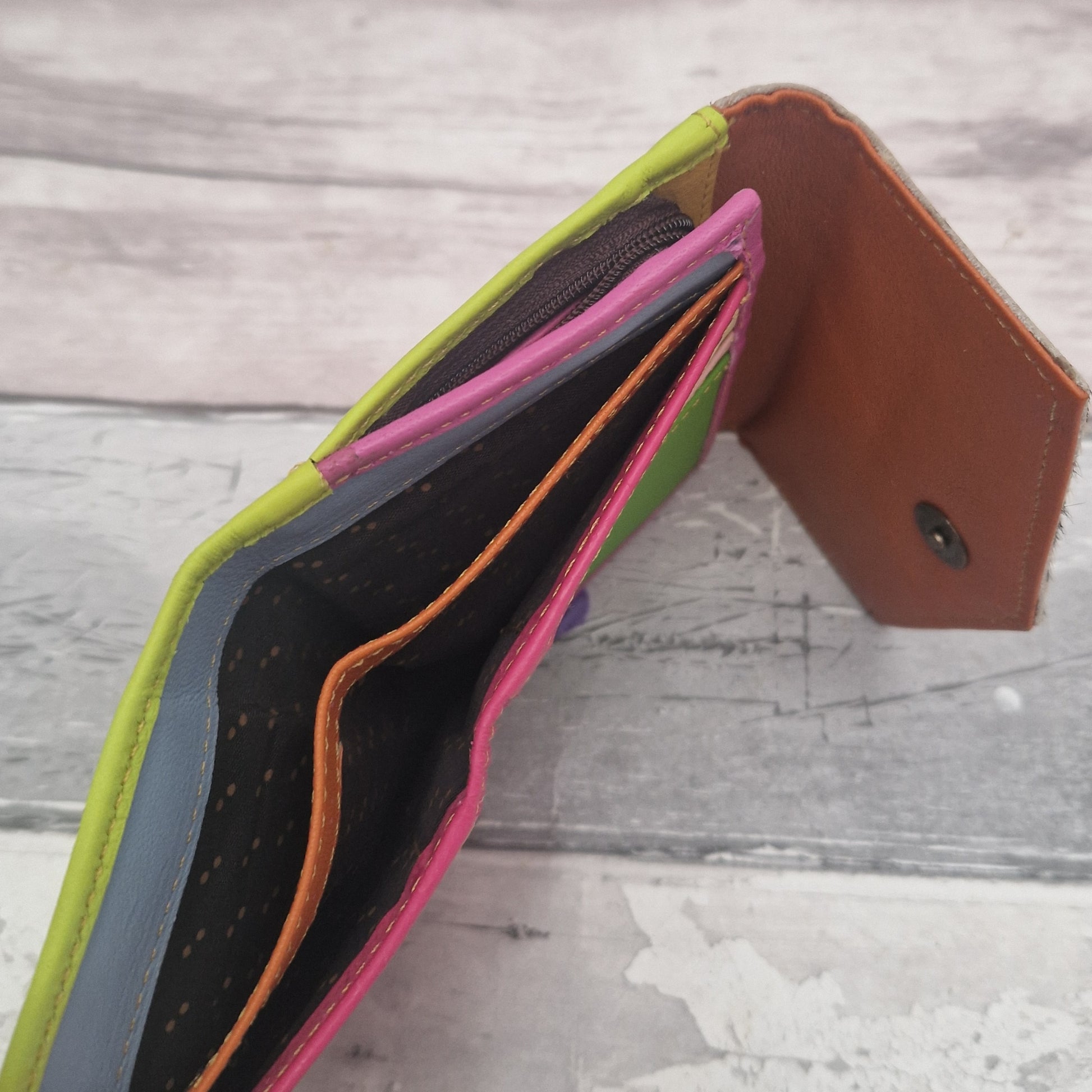 Inside of Devi purse showing 2 large compartment for bank notes.