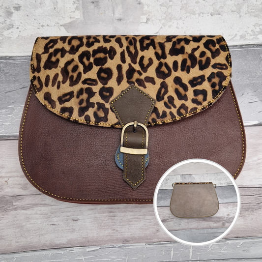 All leather saddlebag style bag in dark brown with a textured panel of Jaguar Animal Print.