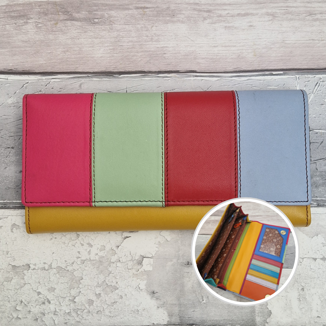 A multi-colored leather wallet with vertical panels in pink, green, red, and blue, resting on a distressed gray wood background. A circular inset in the bottom right shows the interior card slots of the wallet.