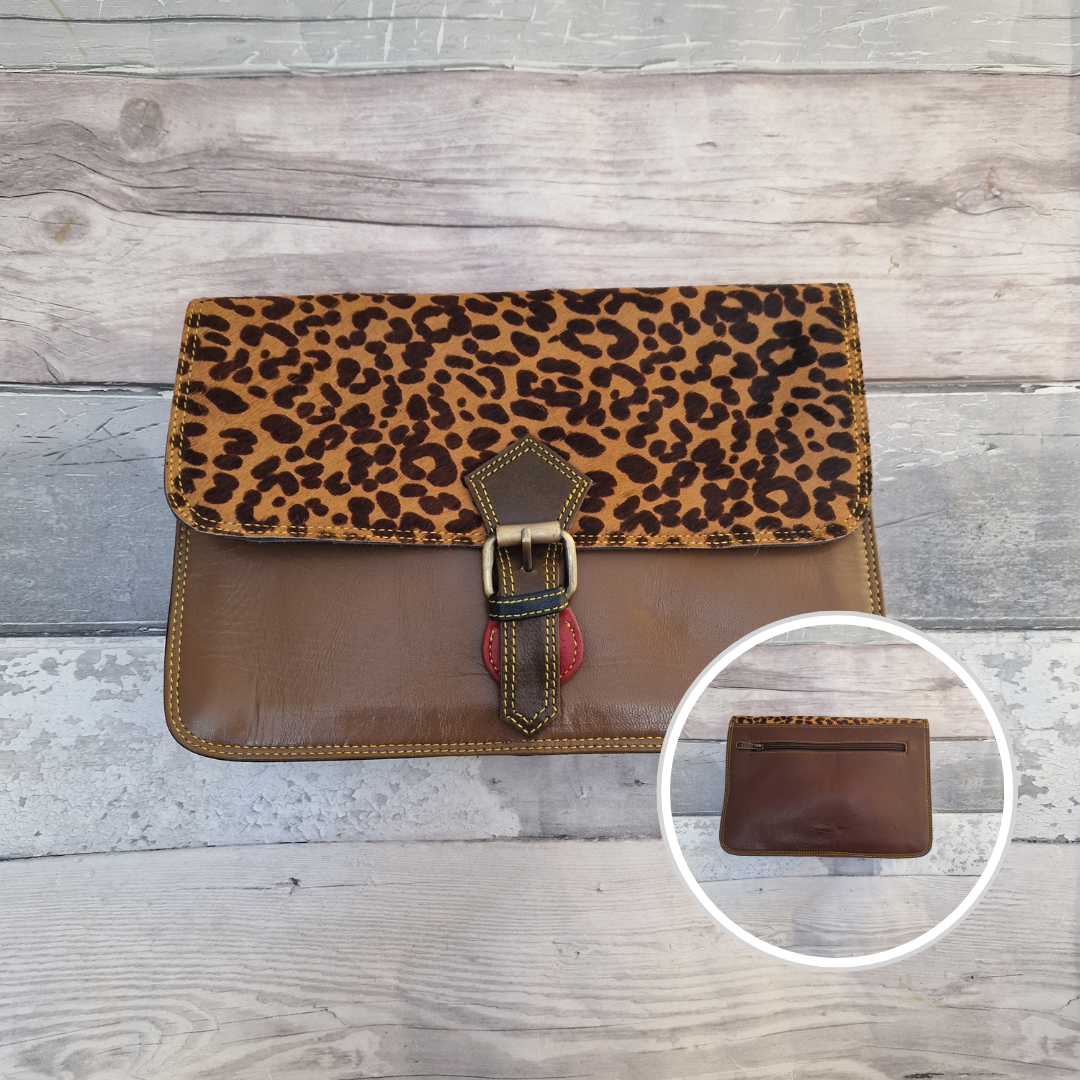 All leather envelope style crossbody bag in tan with a textured cheetah animal print panel. Photo shows front and back of bag.