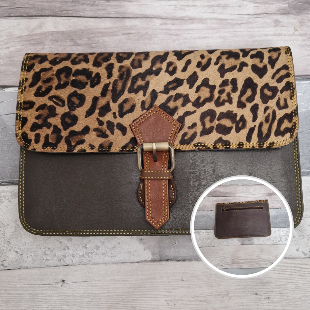 All leather envelope style crossbody bag in grey with a textured jaguar animal print panel. Photo shows front and back of bag.