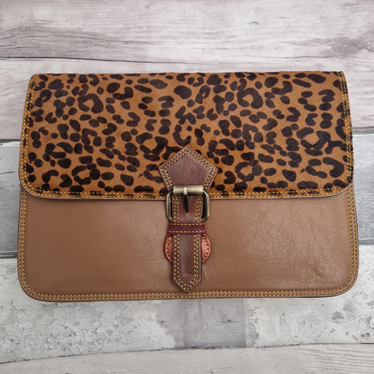 Brown Leather envelope style bag with textured panel of cheetah print and buckle clasp.