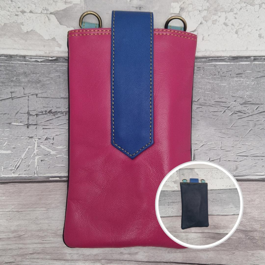 Pink phone case with blue accent on a wooden surface