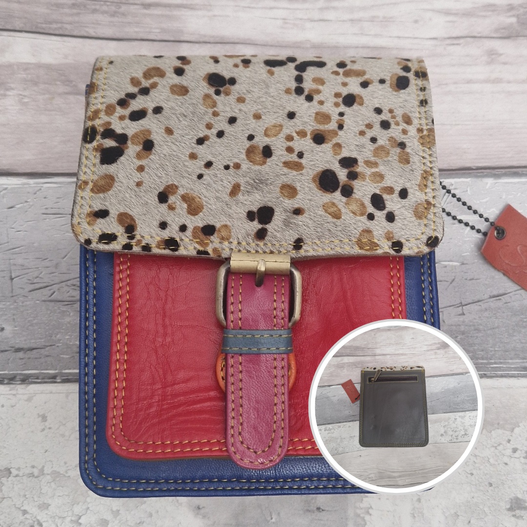 All leather mini satchel style bag with red and blue panel finished with a textured wild spot animal print.