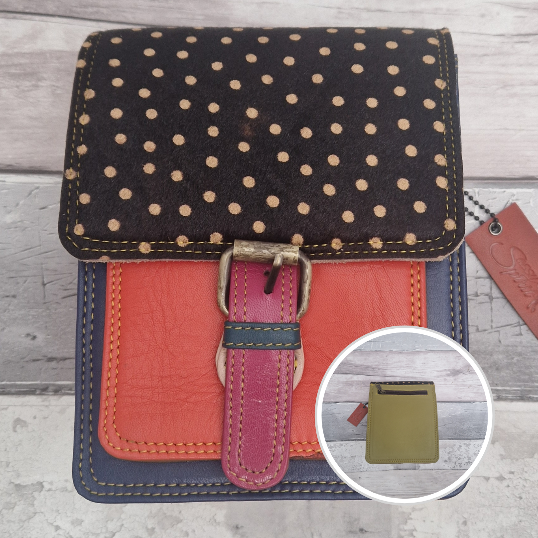 All leather mini satchel style bag with navy and orange panel finished with a textured dark spot print.