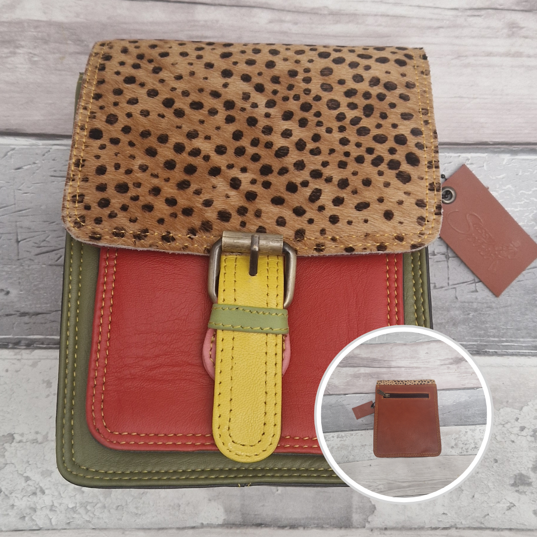 All leather mini satchel style bag with green and orange panel finished with a textured wild spot animal print.