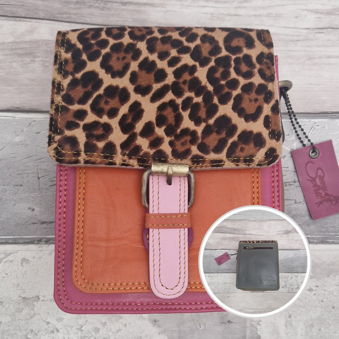 All leather mini satchel style bag with pink and orange panel finished with a textured leopard animal print.