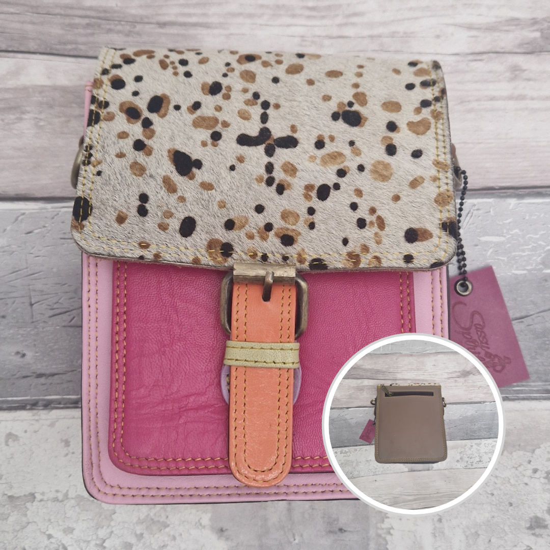 All leather mini satchel style bag with pink panels finished with a textured wild spot animal print.