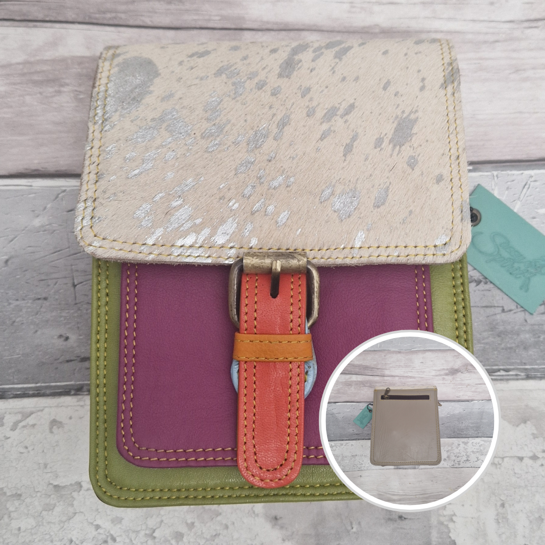 All leather mini satchel style bag with green and magenta panel finished with a textured metallic pony animal print.