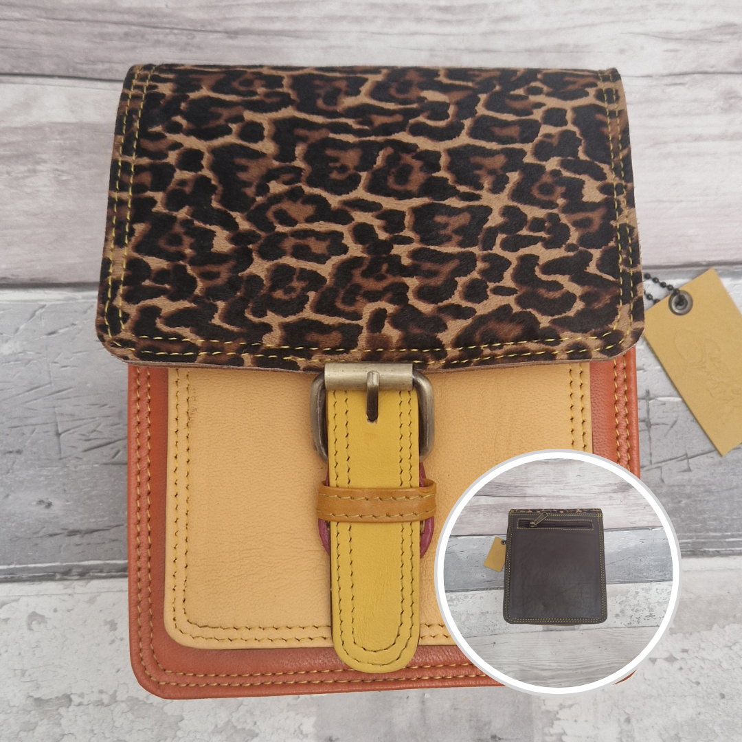 All leather mini satchel style bag with yellow and orange panel finished with a textured jaguar animal print.