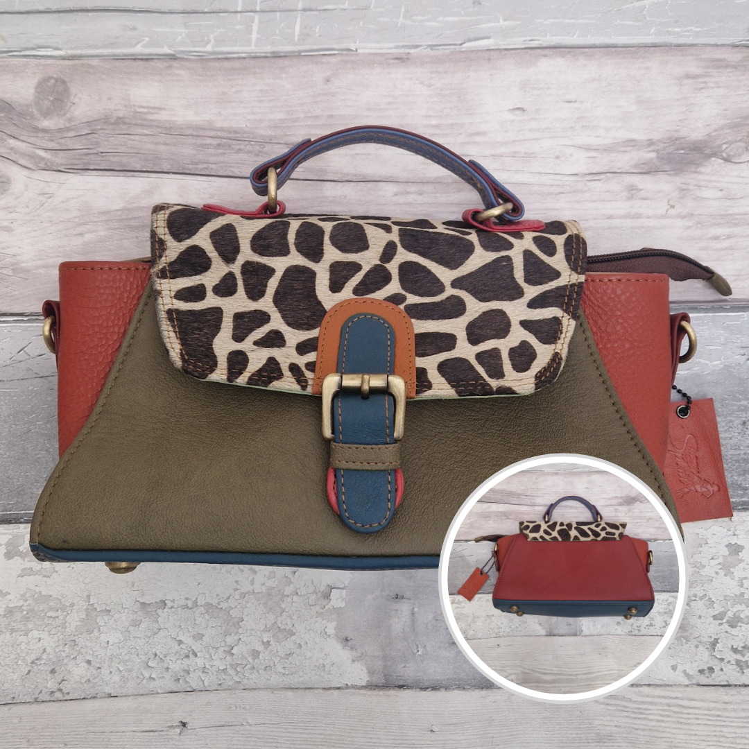 Mini satchel style ladies all leather handbag. Mixed green and red colours with a textured giraffe print panel.